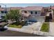 Charming two-story home with a well-manicured lawn, mature tree, and three-car garage at 9709 Casper Peak Ct, Las Vegas, NV 89117