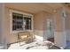 Cozy covered front porch with bench seating at 9709 Casper Peak Ct, Las Vegas, NV 89117