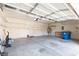 Spacious two-car garage with overhead lighting, shelving, and ample storage space at 9709 Casper Peak Ct, Las Vegas, NV 89117