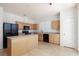 Well-lit kitchen features modern appliances, center island, and ample cabinet space at 9709 Casper Peak Ct, Las Vegas, NV 89117