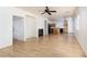 Bright living area with hardwood floors, fireplace, and open concept to the kitchen at 9709 Casper Peak Ct, Las Vegas, NV 89117