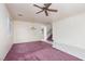 Bright, open living area with ceiling fan, hardwood flooring, and neutral walls at 9709 Casper Peak Ct, Las Vegas, NV 89117