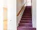 Carpeted staircase leads to the upper level, providing easy access to the home's second story at 9709 Casper Peak Ct, Las Vegas, NV 89117