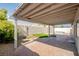 Cozy covered patio space with outdoor seating area and landscaping at 1006 Blue Lantern Dr, Henderson, NV 89015