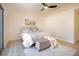 Comfortable bedroom with a ceiling fan, sliding glass doors and decor at 1006 Blue Lantern Dr, Henderson, NV 89015