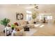 Bright living room featuring a modern sofa, stylish chairs, and large windows that let in plenty of natural light at 1006 Blue Lantern Dr, Henderson, NV 89015