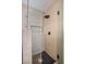 Modern shower featuring neutral tile, rainfall showerhead and built-in niche at 1006 Blue Lantern Dr, Henderson, NV 89015