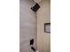 Modern shower featuring a rainfall showerhead, tiled walls, and a built-in niche for storage at 1006 Blue Lantern Dr, Henderson, NV 89015