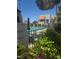 A community pool offering a refreshing escape surrounded by greenery and clear blue water, perfect for summer relaxation at 101 Luna Way # 104, Las Vegas, NV 89145