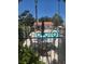 Community pool with poolside seating, surrounded by mature trees, offering a perfect spot for relaxation at 101 Luna Way # 104, Las Vegas, NV 89145