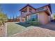 Well-manicured backyard features stylish landscaping and a synthetic grass area at 10342 Kesington Dr, Las Vegas, NV 89135