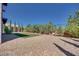 Expansive backyard is enhanced by desert landscaping and a charming grassy area at 10342 Kesington Dr, Las Vegas, NV 89135
