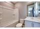 Bright bathroom features a shower-tub combo and single sink vanity at 10342 Kesington Dr, Las Vegas, NV 89135