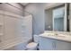 Bright bathroom features a shower-tub combo and single sink vanity at 10342 Kesington Dr, Las Vegas, NV 89135