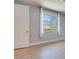 Light, bright bedroom features a large window and neutral color palette at 10342 Kesington Dr, Las Vegas, NV 89135