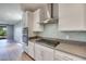 Stylish kitchen featuring white cabinets, stainless steel appliances, and a modern backsplash at 10342 Kesington Dr, Las Vegas, NV 89135