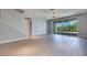 Bright living area with sliding glass doors to the backyard and modern staircase at 10342 Kesington Dr, Las Vegas, NV 89135