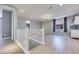 Upstairs living room with vinyl floors, wet bar area, plenty of space, and a modern staircase at 10342 Kesington Dr, Las Vegas, NV 89135
