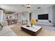 Spacious living room with modern decor and adjacent dining area at 10342 Kesington Dr, Las Vegas, NV 89135