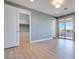 Upstairs bonus room features an ensuite bathroom, walk in closet, balcony, and modern vinyl floors at 10342 Kesington Dr, Las Vegas, NV 89135