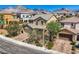 Stunning aerial view of a home in a well-maintained neighborhood with mountain views at 11844 Mino Rio Ave, Las Vegas, NV 89138