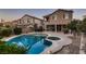 Stunning backyard with pool and spa, complemented by a covered patio and desert landscaping at 11844 Mino Rio Ave, Las Vegas, NV 89138