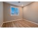 Comfortable bedroom with wood floors and window shutters at 11844 Mino Rio Ave, Las Vegas, NV 89138