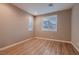 Cozy bedroom with wood floors and window shutters providing natural light at 11844 Mino Rio Ave, Las Vegas, NV 89138