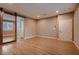 Spacious bedroom featuring modern wood floors and a barn-style sliding door at 11844 Mino Rio Ave, Las Vegas, NV 89138