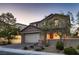 Charming two-story home with desert landscaping, inviting curb appeal, and attached garage at 11844 Mino Rio Ave, Las Vegas, NV 89138