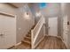 Inviting foyer with staircase, wood floors, and ample natural light at 11844 Mino Rio Ave, Las Vegas, NV 89138
