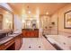 Upscale bathroom featuring dual vanities, shower, and soaking tub at 125 E Harmon Ave # 2801 & 2803, Las Vegas, NV 89109