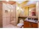 Elegant bathroom with glass shower, sleek vanity, and marble countertop at 125 E Harmon Ave # 2801 & 2803, Las Vegas, NV 89109