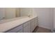 Bathroom vanity featuring sleek countertop and cabinets, providing storage and functionality to the space at 139 Aqua Commons Ln, Henderson, NV 89015