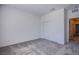 A minimalist bedroom has carpeted flooring and a sliding door closet at 139 Aqua Commons Ln, Henderson, NV 89015