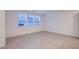 Bright and airy space with multiple windows and modern tile flooring, ready for personalization at 139 Aqua Commons Ln, Henderson, NV 89015