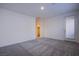 Bright bedroom with plush neutral carpet, a walk-in closet, and a door to a balcony at 139 Aqua Commons Ln, Henderson, NV 89015