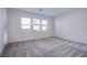 Spacious bedroom with multiple windows, neutral carpet and paint, and plenty of natural light at 139 Aqua Commons Ln, Henderson, NV 89015
