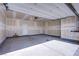 An empty two car garage shows exposed drywall and a modern garage door at 139 Aqua Commons Ln, Henderson, NV 89015