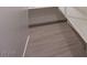 Clean hallway with neutral colors and tile flooring for easy maintenance and a cohesive look at 139 Aqua Commons Ln, Henderson, NV 89015