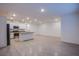 Open concept kitchen and living area featuring stainless steel appliances and recessed lighting at 139 Aqua Commons Ln, Henderson, NV 89015