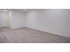 Bright living room with modern tile floors and neutral paint provides a blank canvas to create your own inviting space at 139 Aqua Commons Ln, Henderson, NV 89015