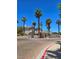 Gated community entrance with mature trees and brick driveway at 1500 Cardinal Peak Ln # 201, Las Vegas, NV 89144