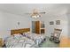 Bedroom featuring two beds, ceiling fan, and access to an en-suite bathroom at 1590 Desertaire Way, Las Vegas, NV 89110