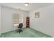 Bedroom with a large window featuring shutter shades and a white desk at 1590 Desertaire Way, Las Vegas, NV 89110