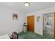 Bright bedroom features a closet with wood doors and a hallway view at 1590 Desertaire Way, Las Vegas, NV 89110
