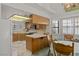 Bright kitchen featuring tile countertops and stainless steel appliances at 1590 Desertaire Way, Las Vegas, NV 89110