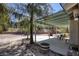 Covered patio area with desert landscaping and a view of the block wall at 1590 Desertaire Way, Las Vegas, NV 89110