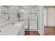 Modern bathroom features glass-enclosed shower, new vanity, and stylish mirror at 1619 Abby Ave, Henderson, NV 89014