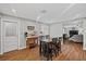 Cozy dining area with wood flooring, direct access to the kitchen and living room, and ample lighting at 1619 Abby Ave, Henderson, NV 89014
